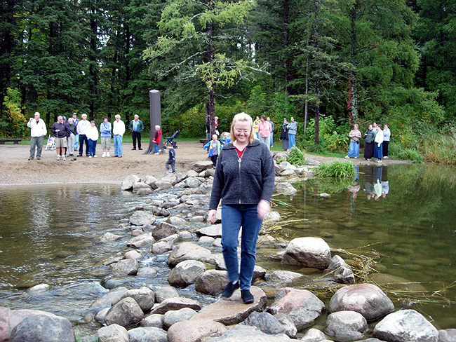 Sarah walks across the Mississippi.